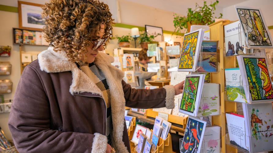 A woman shopping at a store in Lake Placid.