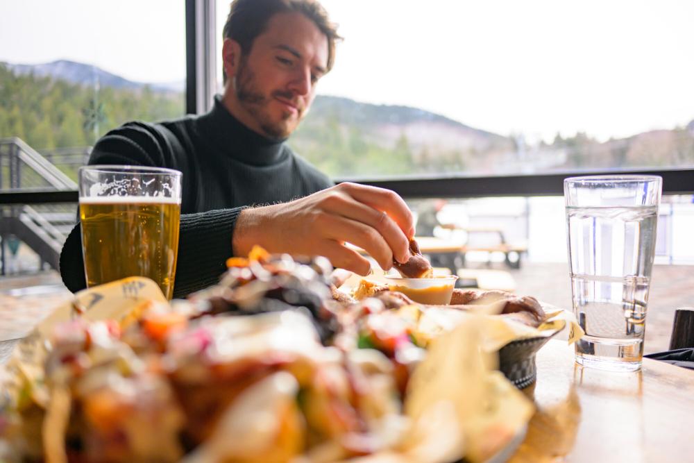 Dining on some nachos and pretzels in a ski lodge