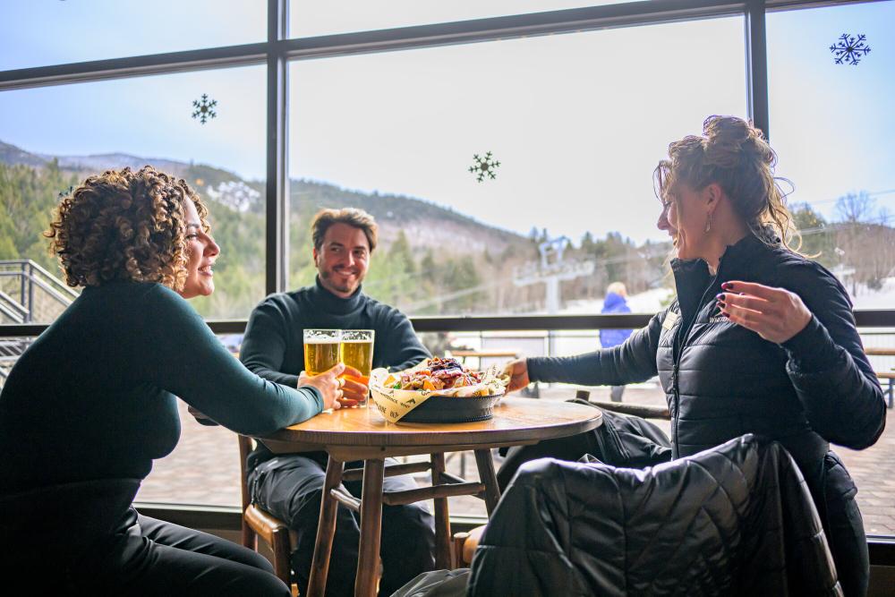 A group of people at a table in a ski mountain's dining area