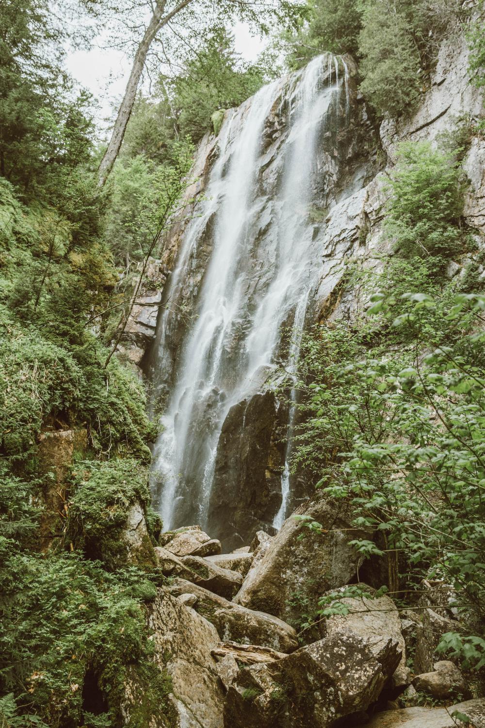 Photograph of a beautiful waterfall cascading down a mountainside in the Adirondacks in spring