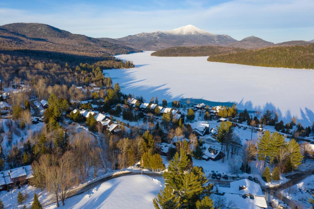 An aerial view of Lake Placid, Main Street, and Mirror Lake in the winter.