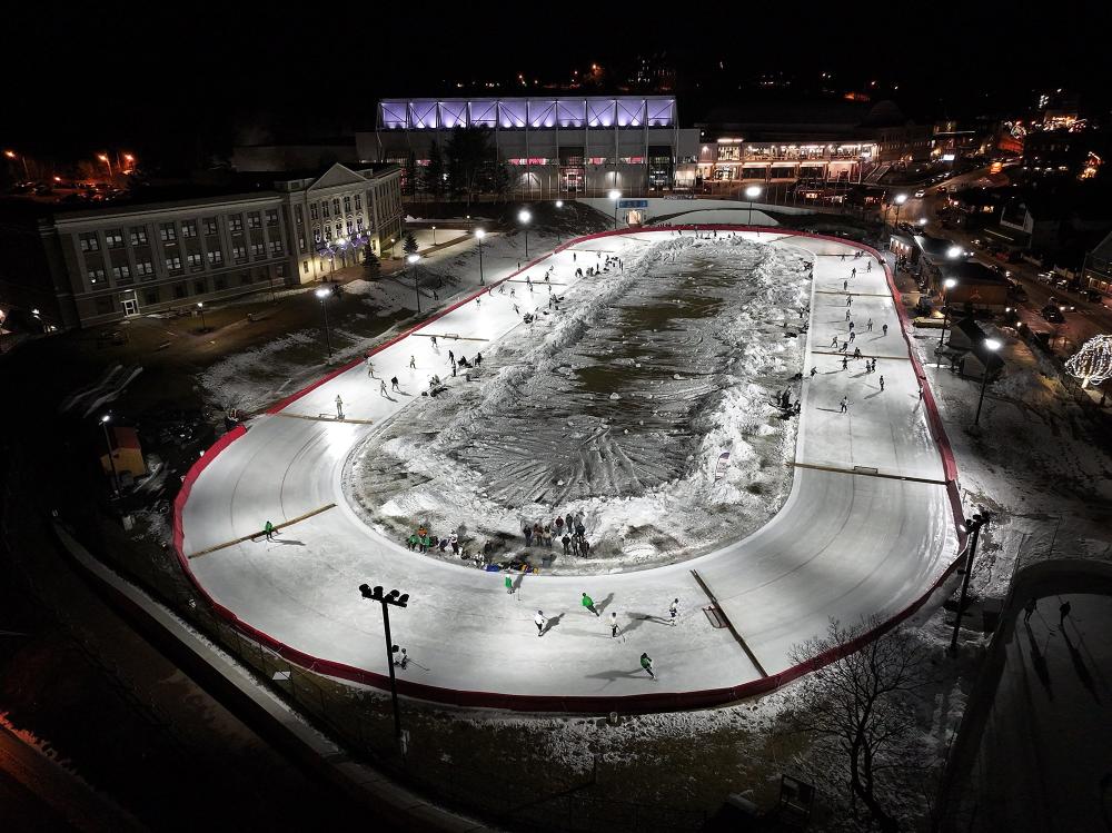 An aerial view of the Lake Placid Olympic Oval, converted into pickup hockey rinks.