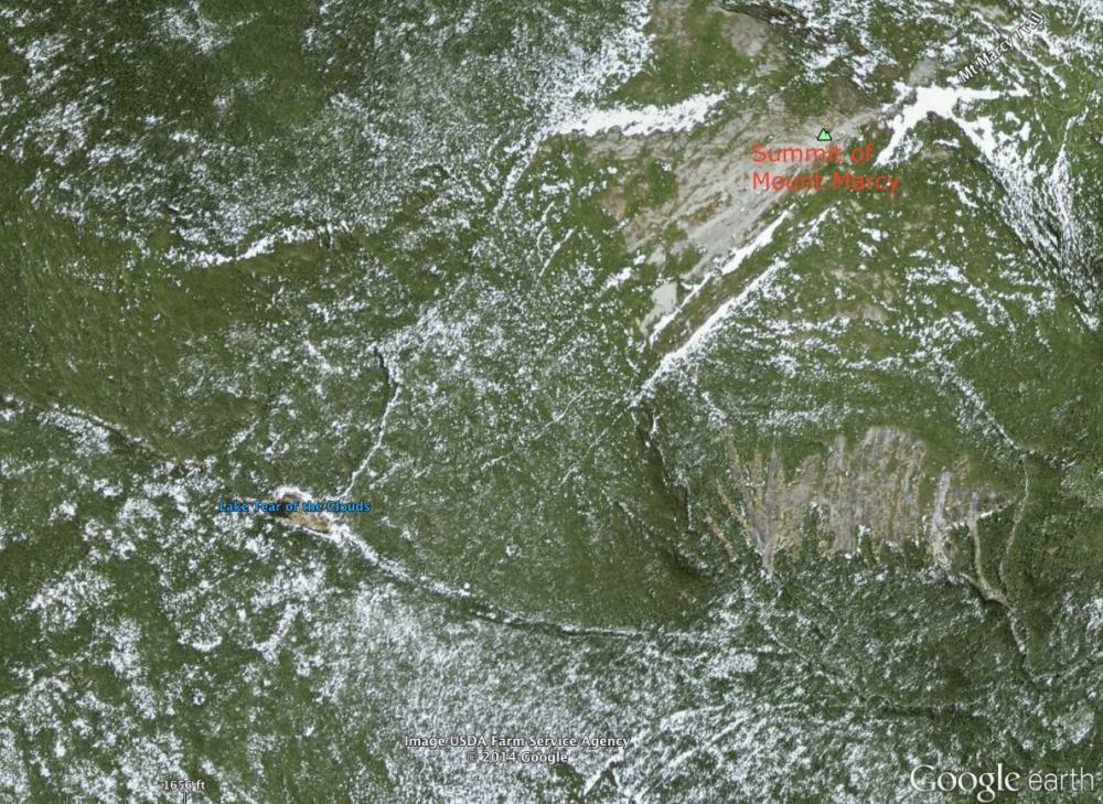 Lake Tear of the Clouds sits in a col to the southwest of the summit of Mt. Marcy, the highest point in New York State