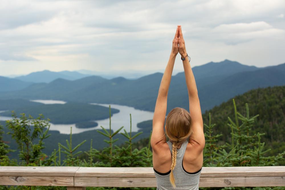 A woman doing yoga on Whiteface Mountain.