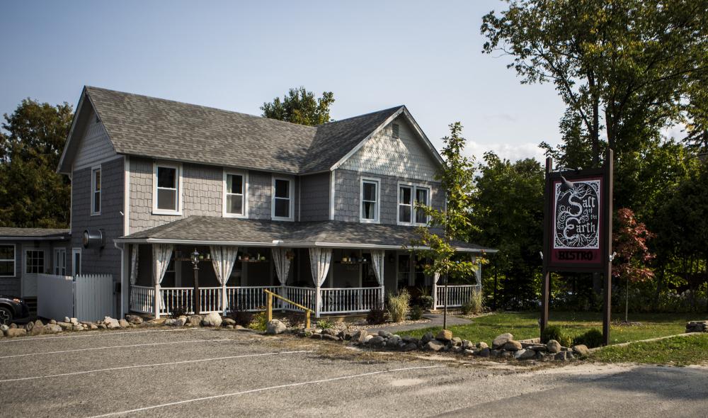 restaurant located inside of a charming gray house