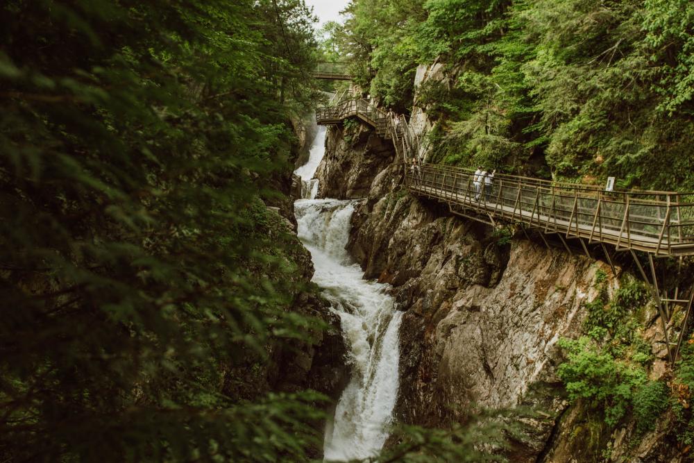 A picture of a tall waterfall in a chasm.