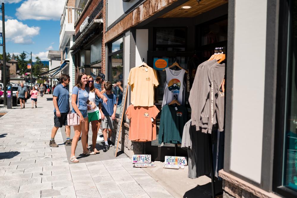 A family explores the shops on Lake Placid's Main Street.