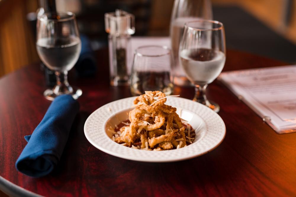 Plated food on a dining table from Amado restaurant.