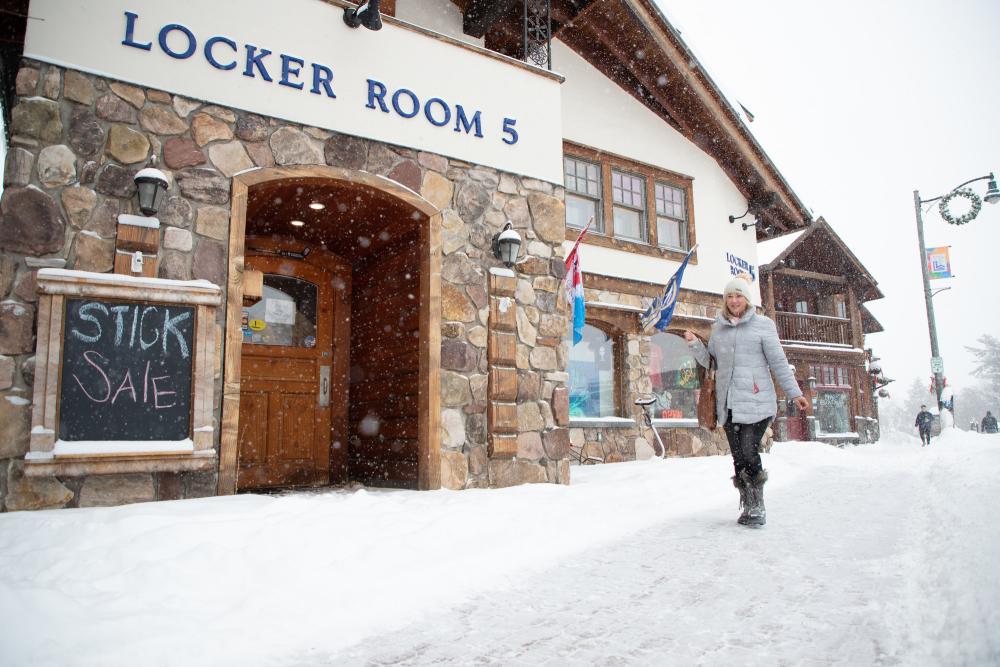 a woman walks past locker room 5.