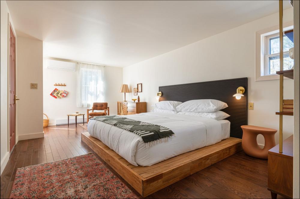 A modern bedroom with bright natural light.