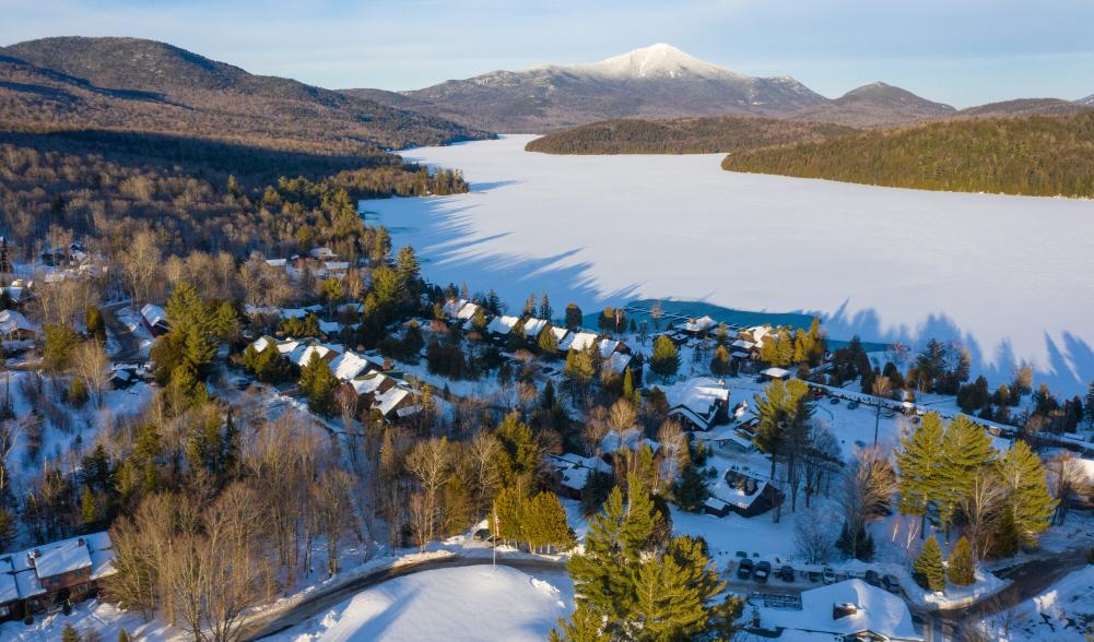 An aerial view of Lake Placid, Main Street, and Mirror Lake in the winter.