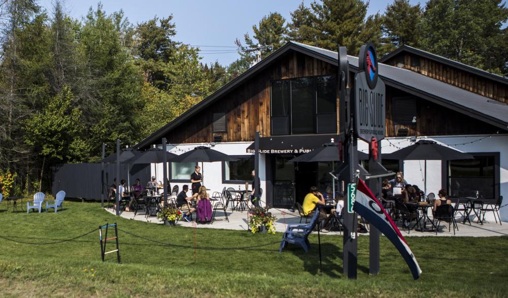 The exterior of a chalet-style brewpub.