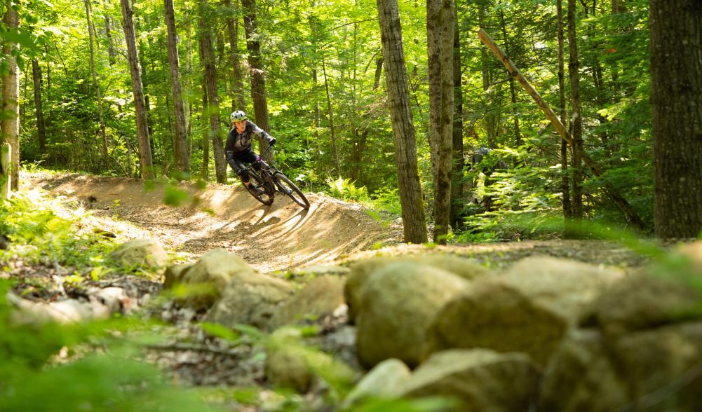 mountain biker riding a berm