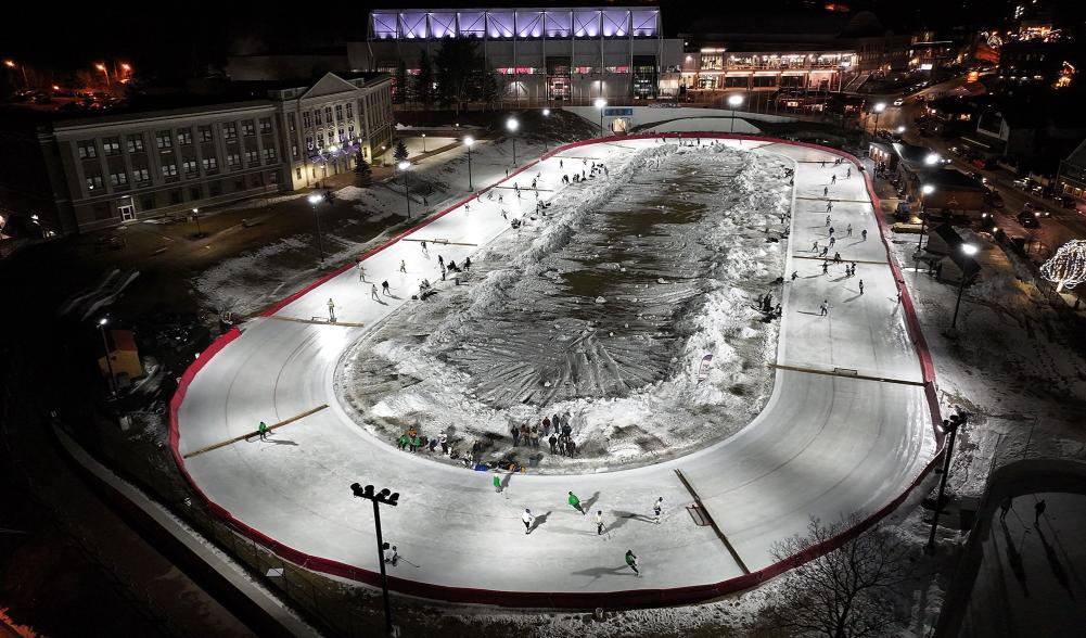 An aerial view of the Lake Placid Olympic Oval, converted into pickup hockey rinks.