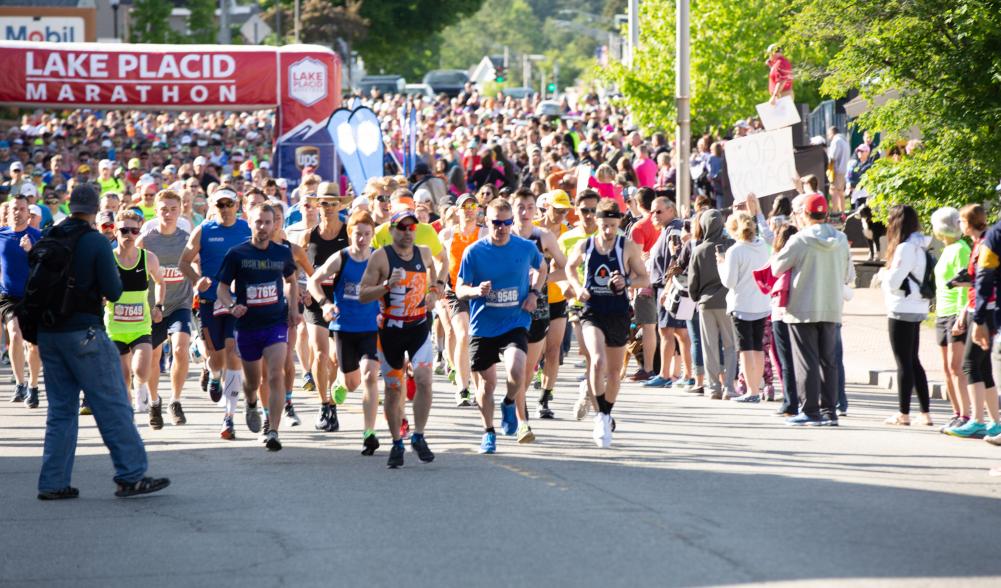 a large crowd of runners start the Lake Placid Marathon.