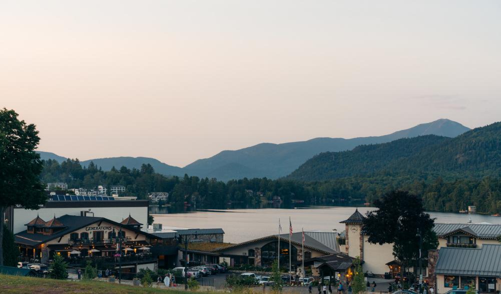 A view of Generations restaurant at sunset with Mirror Lake in the backgound.