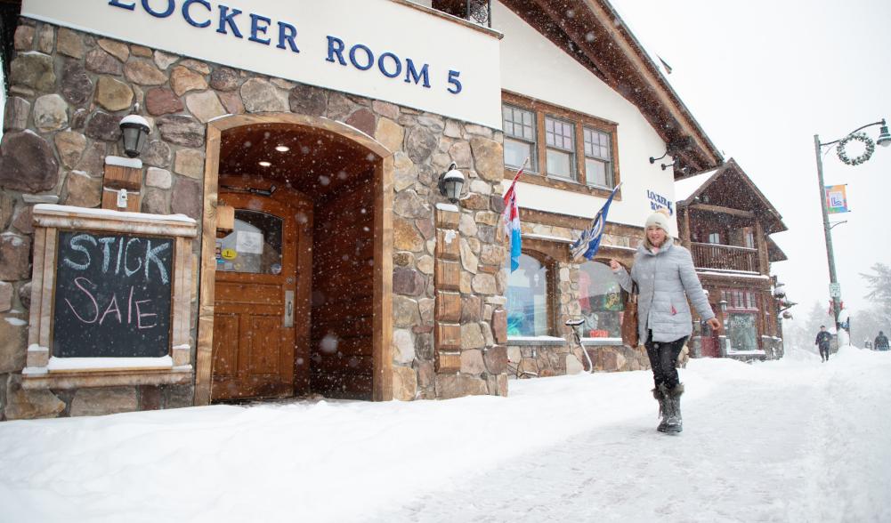 a woman walks past locker room 5.