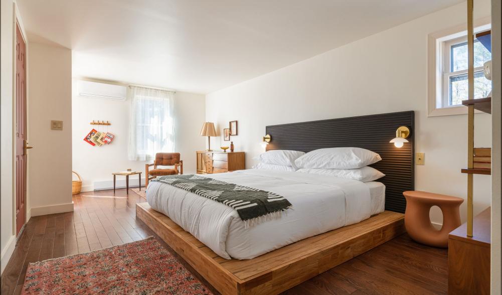 A modern bedroom with bright natural light.