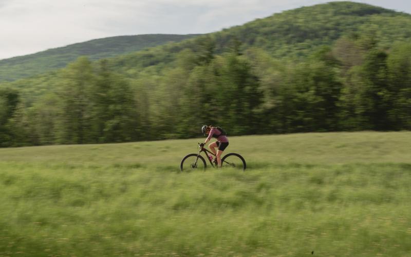 Bike racer crosses field