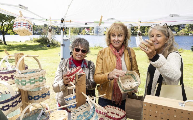 Shoppers look at baskets at the ArtMarket