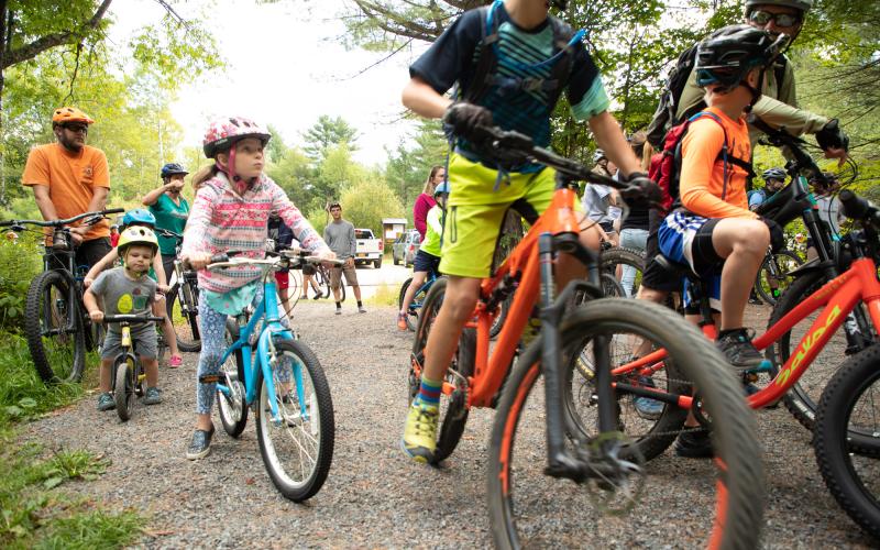 Group of colorful outfits and bikes with participants of all ages