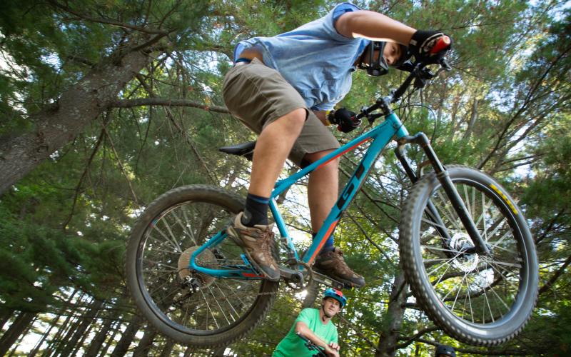 Jumping a bike in the woods