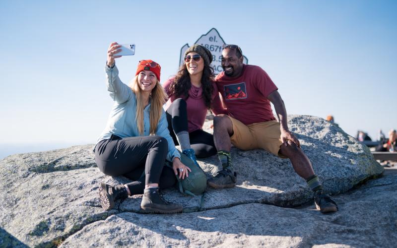 Hiking group taking selfie on Whiteface summit