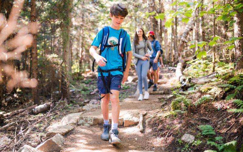 Family hiking on trail