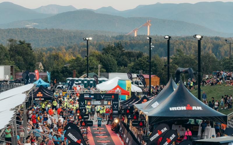 Ironman Lake Placid Finish line with ski jumps and mountains in background