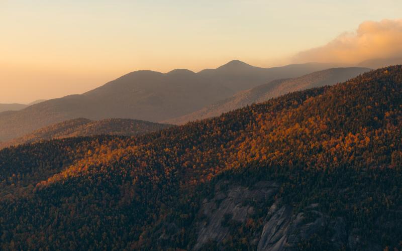 The view of tall mountains in the fall