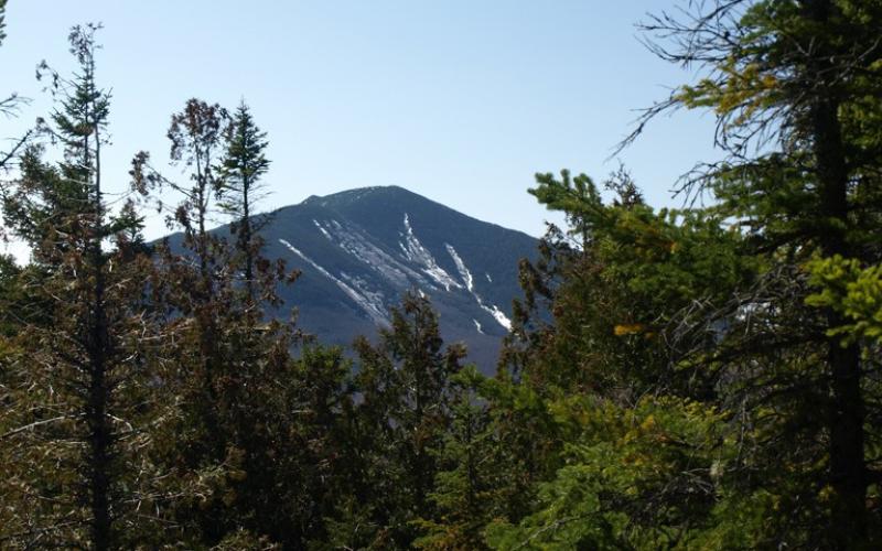 Dix Mountain can be seen from here, with the distinctive stripes of late fall ski trails.