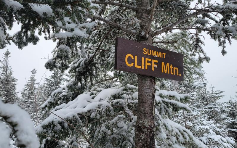 A wooden sign for the summit of Cliff Mountain