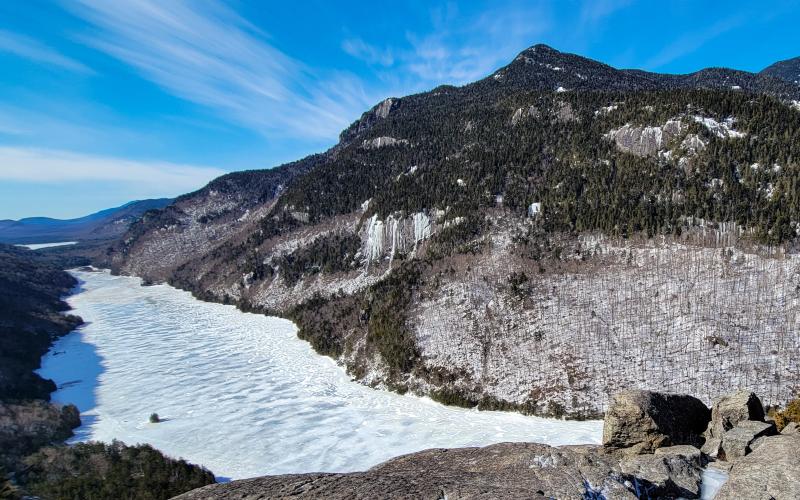 A frozen lake between two mountains