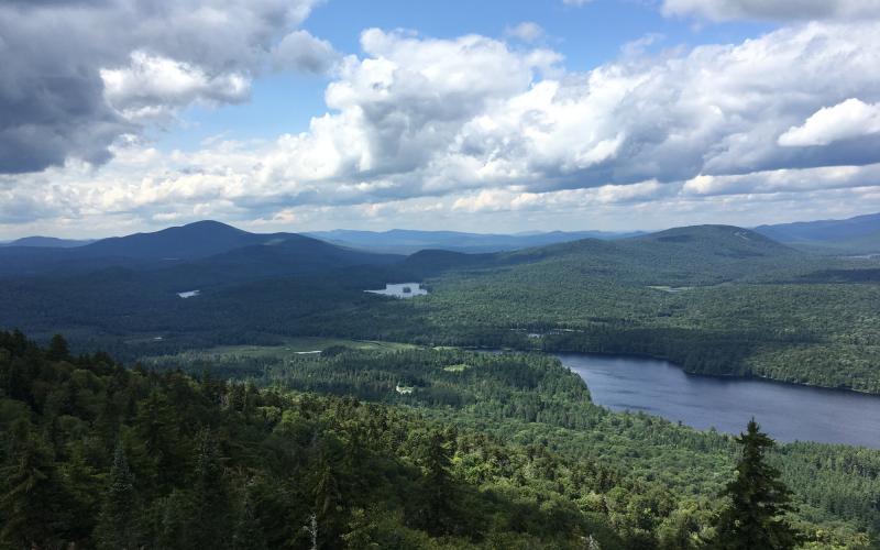 A lake surrounded by low mountains, seen from high above