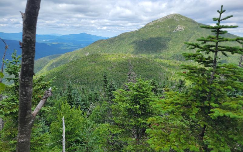 A tall mountain seen from another mountain