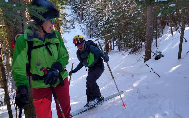 Group of back country skiers ascend a hill