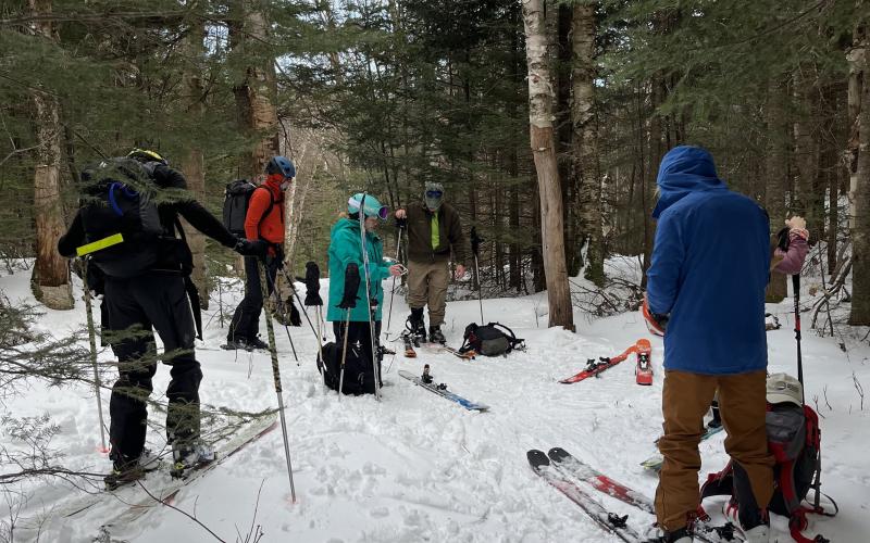 Group of back country skiiers take a break