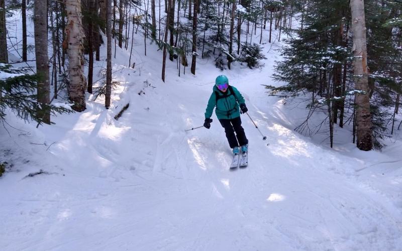 back country skier slides towards the camera