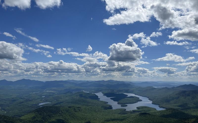 Lake Placid shimmers under puffy white clouds