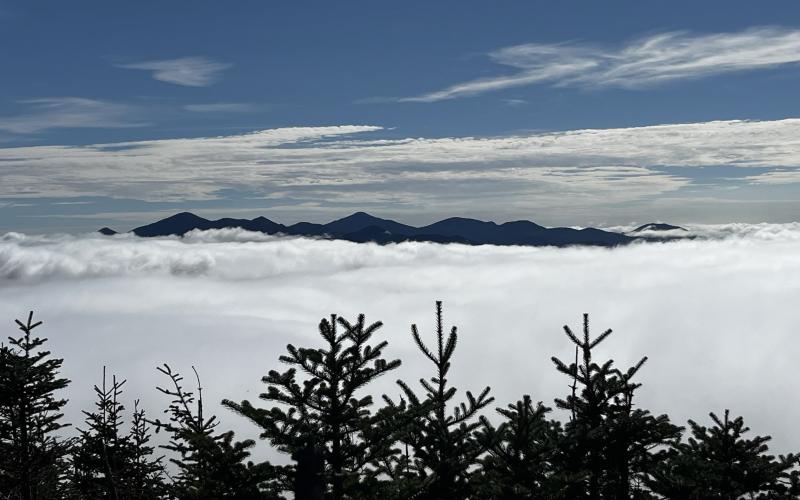 Mountains peek out from the clouds