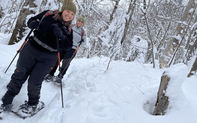 Smile into the camera on the snowshoe trail